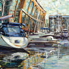 St Katharine Docks marina scene with boats and a building reflections in water