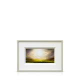 Framed Harry Brioche artwork of a landscape with a moody sun in the sky on a white background