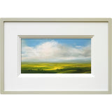 Framed Harry Brioche artwork of a landscape with green fields and blue sky.