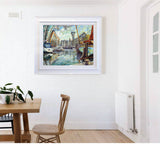Artist Allan Stephens' 30 inch limited edition print of "St.Katharine Docks" displayed in a casual, open plan kitchen diner.