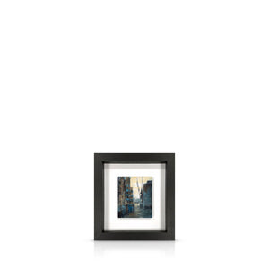 A framed 9 inch artwork featuring the warehouses of Butlers Wharf leading to the River Thames, float-mounted on a black frame.