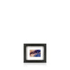 A framed artwork depicting a swirling, expressionistic Houses of Parliament, mounted on a black frame.