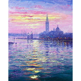 The Palladian church and famous landmarks of San Giorgio Maggiore set against a burning sky, surrounded by sparkling waters.